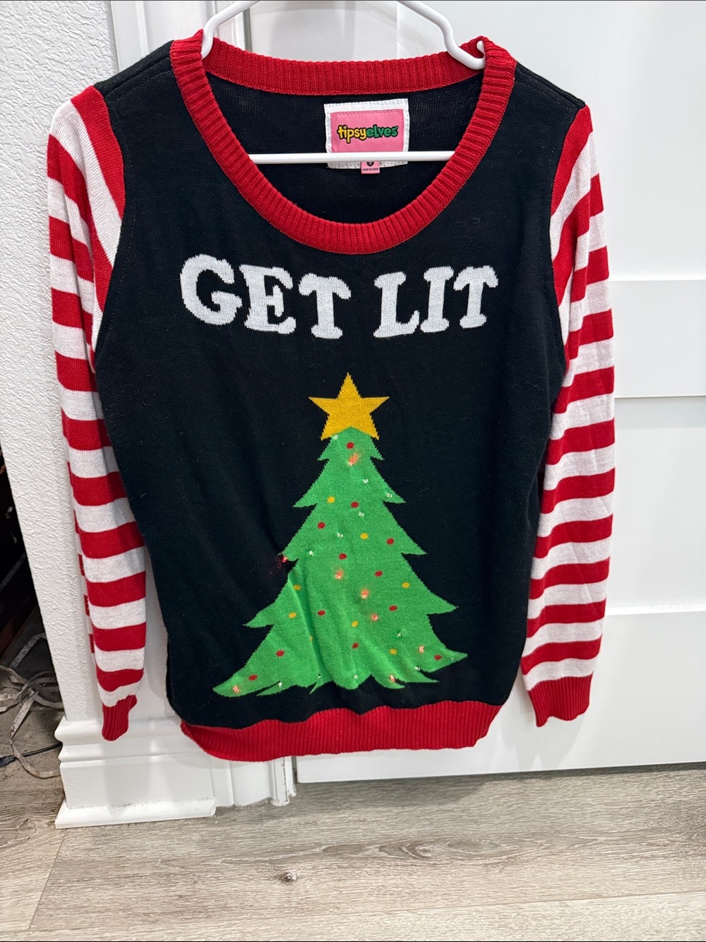 Tipsy Elves Black Sweater with Red & White Stripe Sleeves and Green Tree